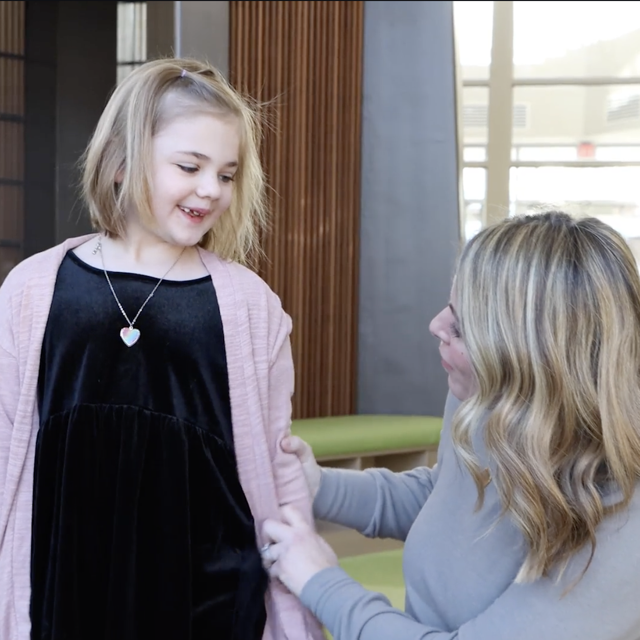  Rosie stands with her teacher